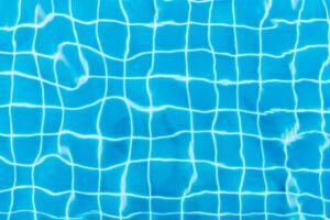 top view photography of blue pool tiles